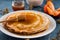 Fresh pancakes with honey, maple syrup, cottage cheese and tangerines. Wooden background. Top view