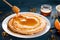 Fresh pancakes with honey, maple syrup, cottage cheese and tangerines. Wooden background. Top view