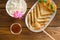 Fresh pancakes with honey, maple syrup, cottage cheese and tangerines. Wooden background. Top view