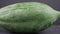 Fresh papaya on dark background. Shot with slider or move camera. 4K Resolution