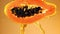 Fresh papaya with a splash of juice. Filmed on a high-speed camera at 1000 fps.