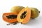 fresh Papayas on a pristine white background. The Papaya is perfectly ripe and bursting with flavor