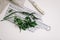 Fresh parsley, greenery with knife and kitchen towel on cutting board isolated on white. fresh healthy meal. Top view, flat lay