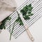 Fresh parsley, greenery with knife and kitchen towel on cutting board isolated on white. fresh healthy meal. Top view, flat lay