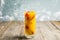 Fresh peach beverage with red ripe raspberry on the rustic background