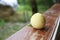 Fresh peaches on wooden table against green blurred background . green background on peach wooden table