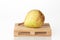 Fresh pear on logistic pallet waiting for transportation to destination place isolated over white background. Fruits export or