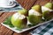 Fresh pears stuffed with cottage cheese closeup on table