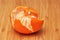 The Fresh peeled Clementines on wooden board, from above