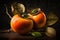 Fresh persimmon fruits with leaves on dark background