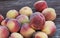 Fresh picked Fuzzy peaches gathered on a table