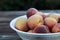 Fresh picked Fuzzy peaches gathered on a table