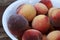 Fresh picked Fuzzy peaches gathered on a table