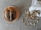 Fresh pickers on a wooden plank, near dried mushrooms on a dryer and in a cloth bag