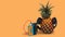 fresh pineapple with black headphones and wlakman orange background