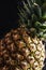 Fresh pineapple, dark wood background, selective focus