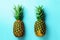 Fresh pineapples on blue background. Top View. Pop art design, creative concept. Copy Space. Bright pineapple pattern