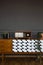 Fresh plants and vintage radio placed on wooden cupboard