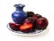 Fresh plums on ceramic plate