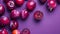 Fresh plums on purple background