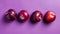 Fresh plums on purple background