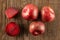 Fresh pluot interspecific plums on brown wood