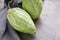 Fresh pointed cabbages on grey table