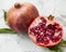 Fresh pomegranate fruit closeup. Whole and half of pomegranate fruit