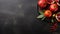 fresh pomegranates and leaves on a black table