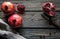 Fresh pomegranates on a wooden background. Organics, fruit, food