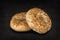 Fresh poppy seed bagel bread, isolated on a natural slate stone