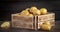 Fresh potatoes in a wooden box with cool steam.