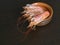 Fresh prawns on the kitchen table in a bowl. Cooked fresh giant prawns