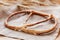 Fresh Pretzel with sesame seeds on rustic background