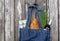 Fresh produce in blue denim market bag on wooden background, flat lay. Eco friendly reusable shopping bag for minimize waste,