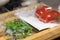 fresh products prepacked for salad. Tomatoes, sour cream, arugula.