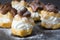 Fresh profiteroles with cream and chocolate