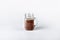 Fresh protein shake, milk with cocoa in a glass jar on a white background