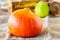 Fresh Pumpkin. Autumn fruits and vegetables. Autumn colors. Vibrant colors. Pumpkin, nuts and pear. Stocks for winter. Autumn is c