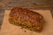 A fresh pumpkin seed bread from the baker on a jute fabric