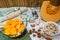 Fresh pumpkin squash on kitchen table with baking ingredients