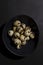 Fresh quail eggs. Rustic style on dark background