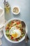 Fresh quinoa tabbouleh salad with fried egg