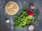 Fresh radish with tops, coarse salt and homemade pita on a gray background