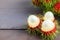 Fresh rambutan peeled on wood table with bunch of fresh ripe rambutan background. Tropical fruit fresh rambutan peeled