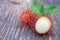 Fresh Rambutan on wooden table background