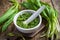 Fresh ramson (wild garlic)pesto on wooden background