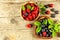 Fresh raspberries and blueberries on an old wooden table. Fruit picking. Healthy fruit. Sales of blueberries and raspberries.