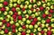 Fresh raspberries and green apples background