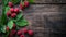 Fresh raspberries with green leaves on a rustic wooden background